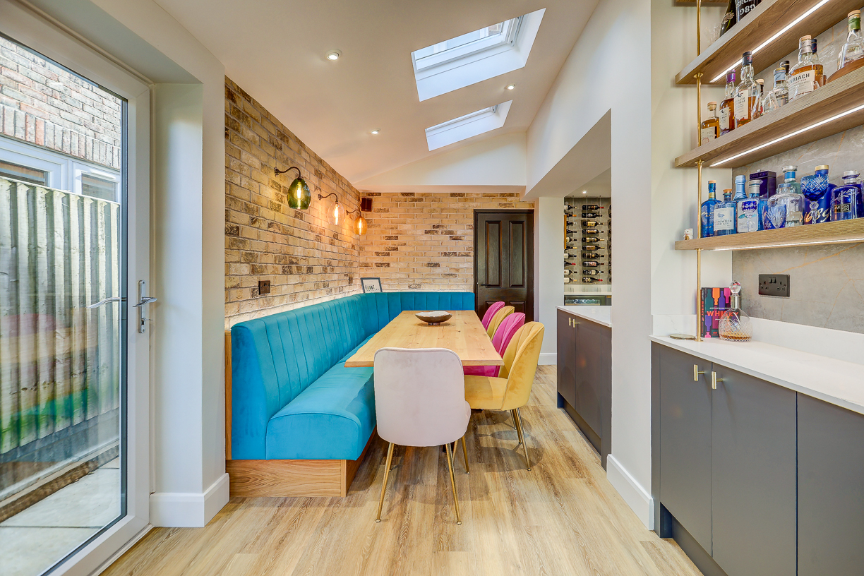 Handleless Kitchen with Banquette Seating Handleless Kitchen with Banquette Seating